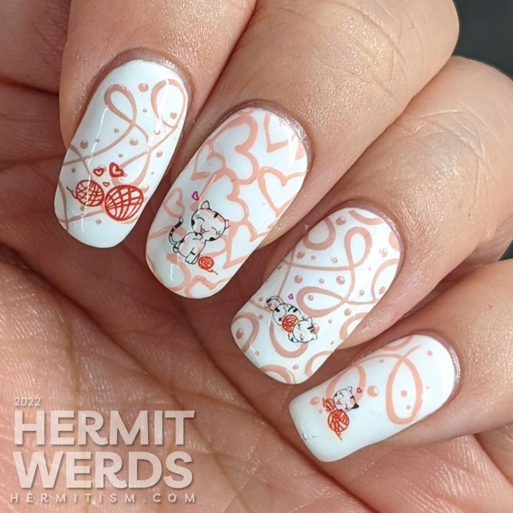 Valentine's nail art in white, red, and pink with water decals of cute white kittens and their love for balls of yarn.