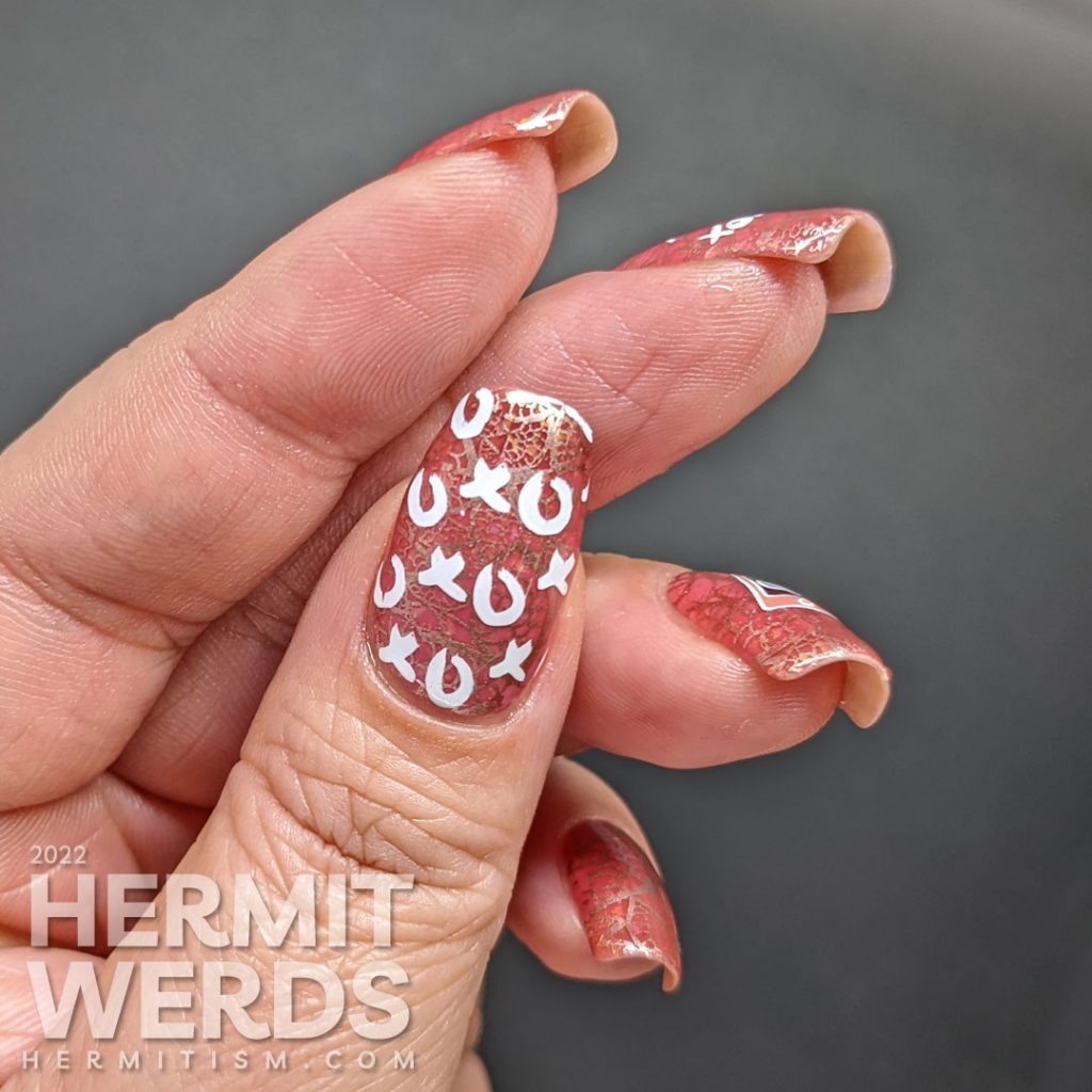 A Valentine's Day nail art with rosegold lace stamping on a pink thermal jelly with reverse stamping decals saying "Call me! XOXO".