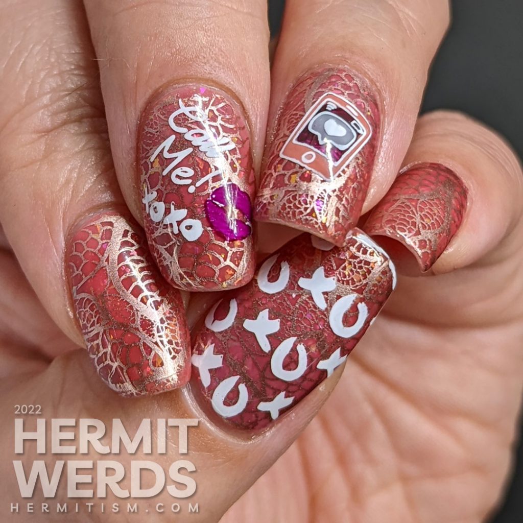 A Valentine's Day nail art with rosegold lace stamping on a pink thermal jelly with reverse stamping decals saying "Call me! XOXO".