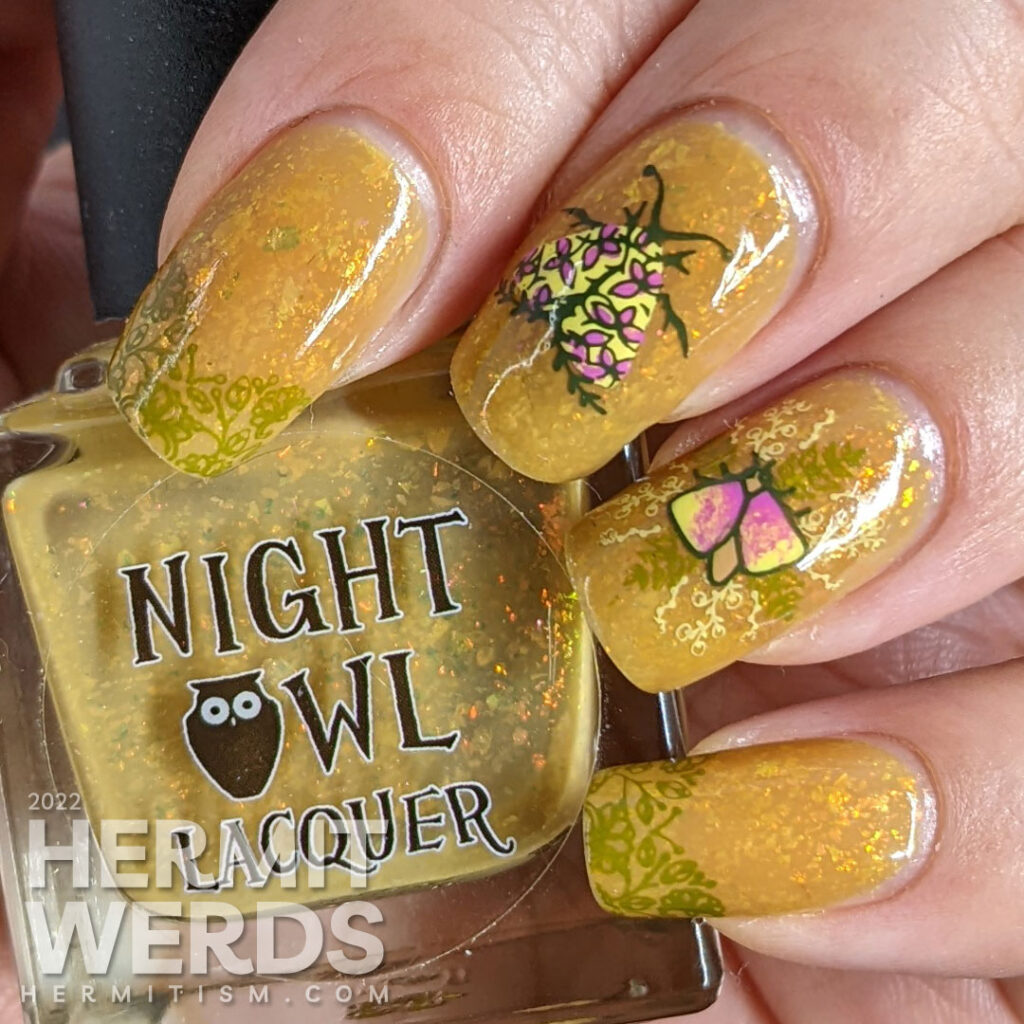 A mustard yellow nail art with whimsical floral patterns and moth stamping images. A ManixMe Springtime Stroll mani.