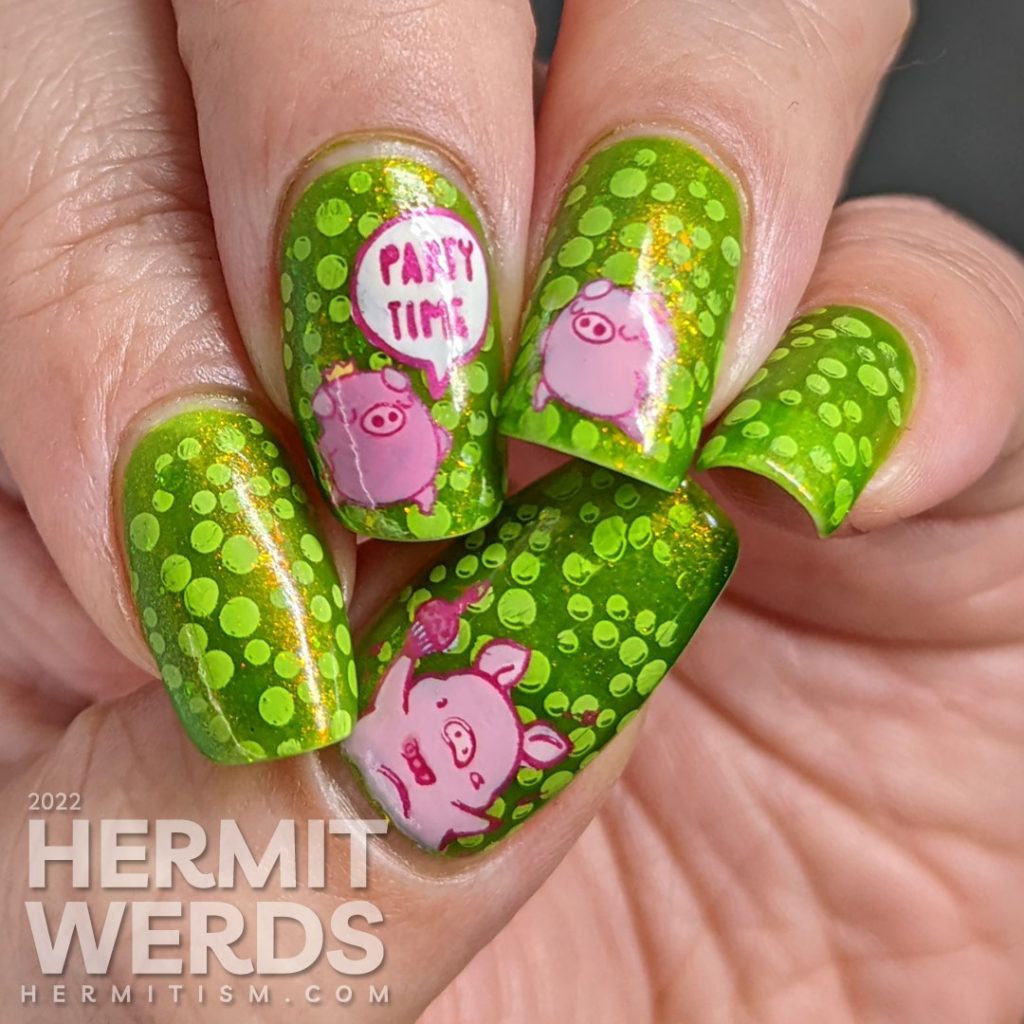 A polka dot pig nail art with party pig reverse stamping decals and polka dots tucked between layers of a bright green jelly polish.