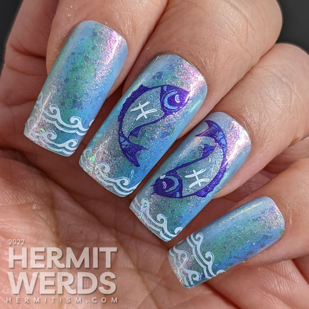 Baby blue Pisces nail art with two large purple and silver fish stamping decals marked with the Pisces sign and wave french tip stampings.