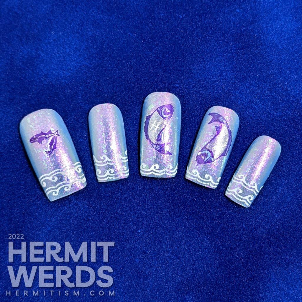 Baby blue Pisces nail art with two large purple and silver fish stamping decals marked with the Pisces sign and wave french tip stampings.