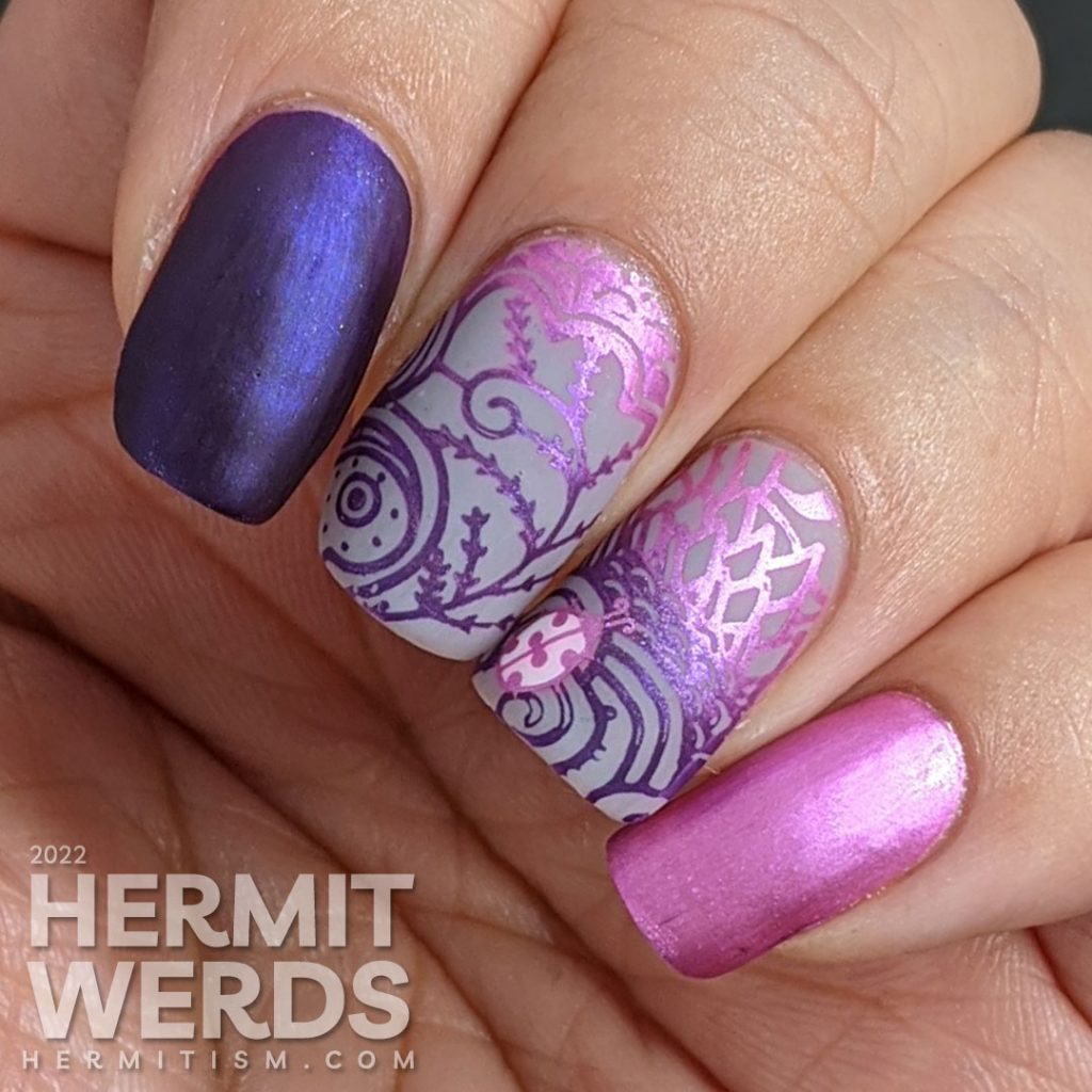 Ladybug nail art with magenta and purple metallic stamping polishes in magically wild patterns.