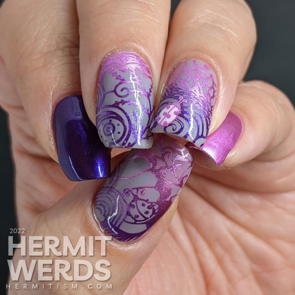 Ladybug nail art with magenta and purple metallic stamping polishes in magically wild patterns.