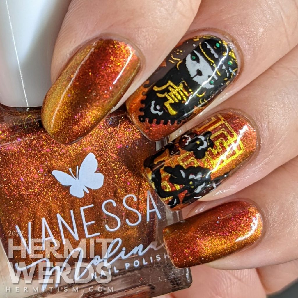 A lovely red, pink, and gold multichrome magnetic nail polish paired with tiger paper cut stamping images for a Year of the Tiger zodiac mani.