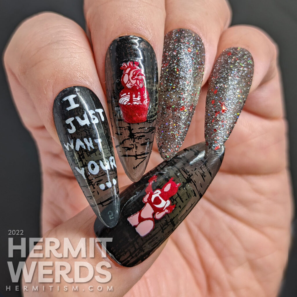 An anti-Valentine yet Halloween gothic nail art with a heart-stealing demon lady and anatomical heart cupcake and gothic reflective glitter.