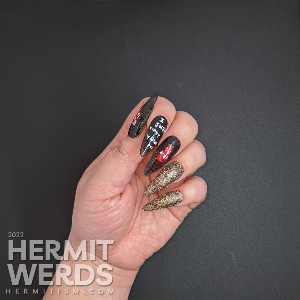 An anti-Valentine yet Halloween gothic nail art with a heart-stealing demon lady and anatomical heart cupcake and gothic reflective glitter.