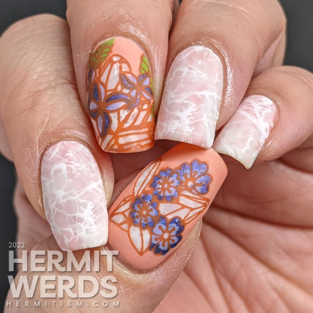 Quartz crystal nail art in soft corals and whites with a reverse stamping images of quartz crystals with purple spring flowers.