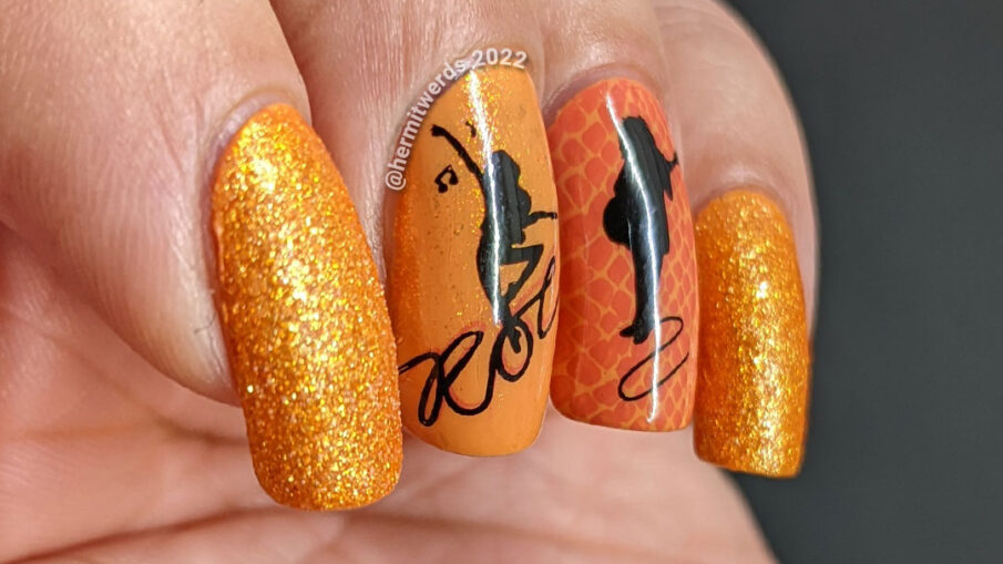 Orange Rock 'n Roll nail art complete with nail stamping of snakeskin animal print, a guitarist, and singer/dancer, and Pixiedust polish.
