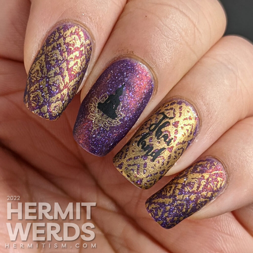 A brocade-like Thailand nail art featuring Buddah meditating over a lotus blossom + a Thai flame fabric pattern over a flakie purple polish.