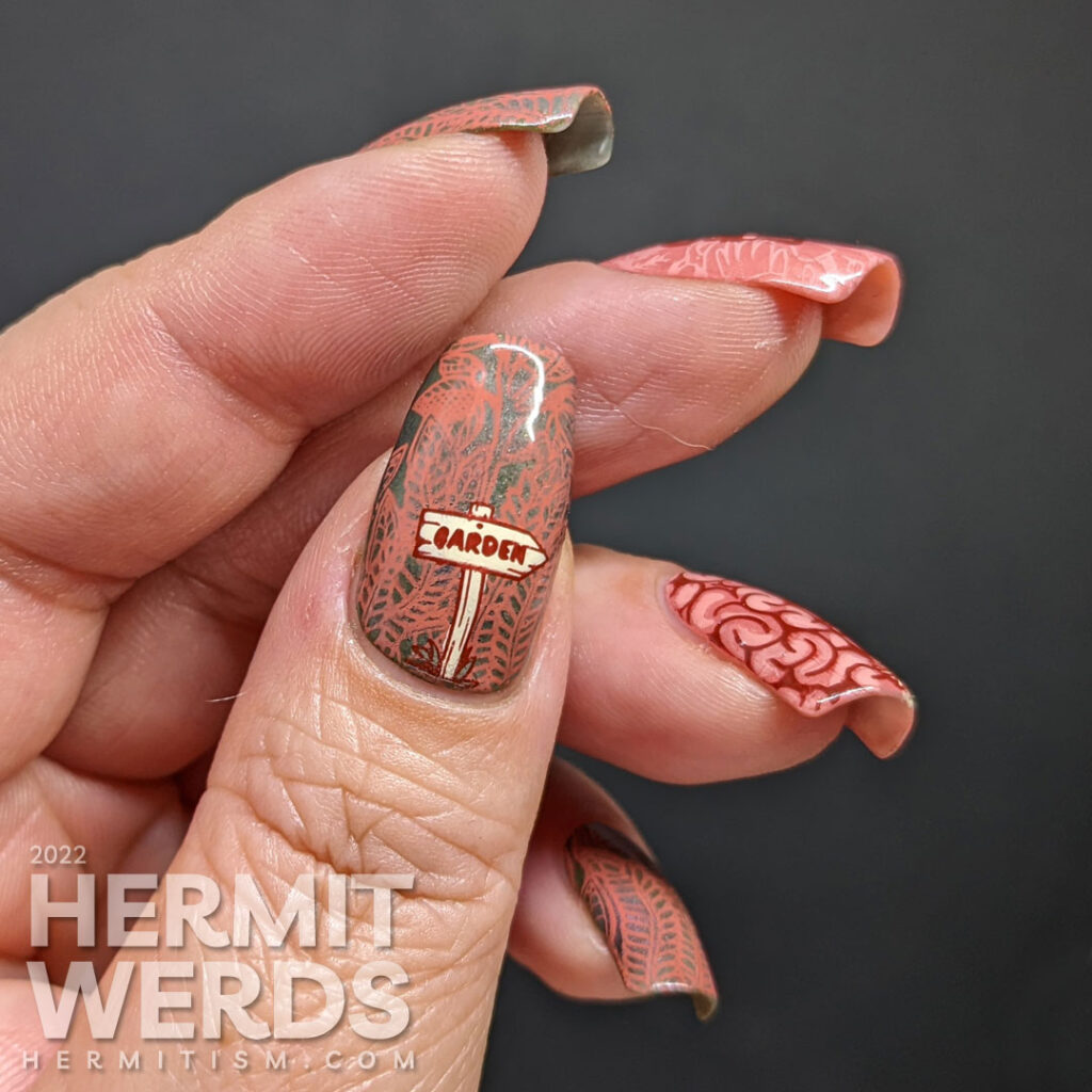 A salmon pink and green gardening nail art for people with plants on the brain. Actual brain and flower reverse stamping decals.