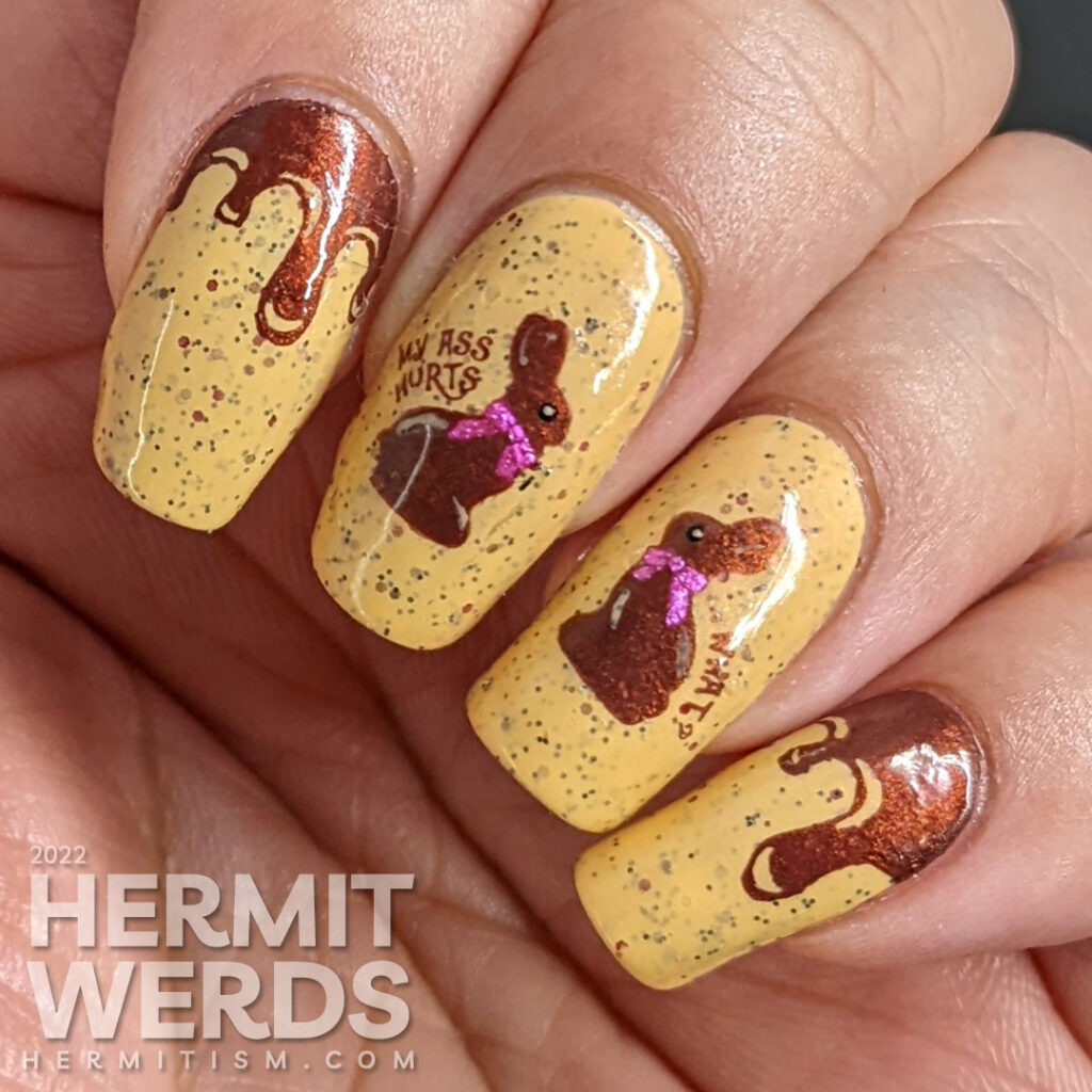 A mustard crelly with small purple and red glitters with chocolate Easter bunny stamping decals who have been munched on top.