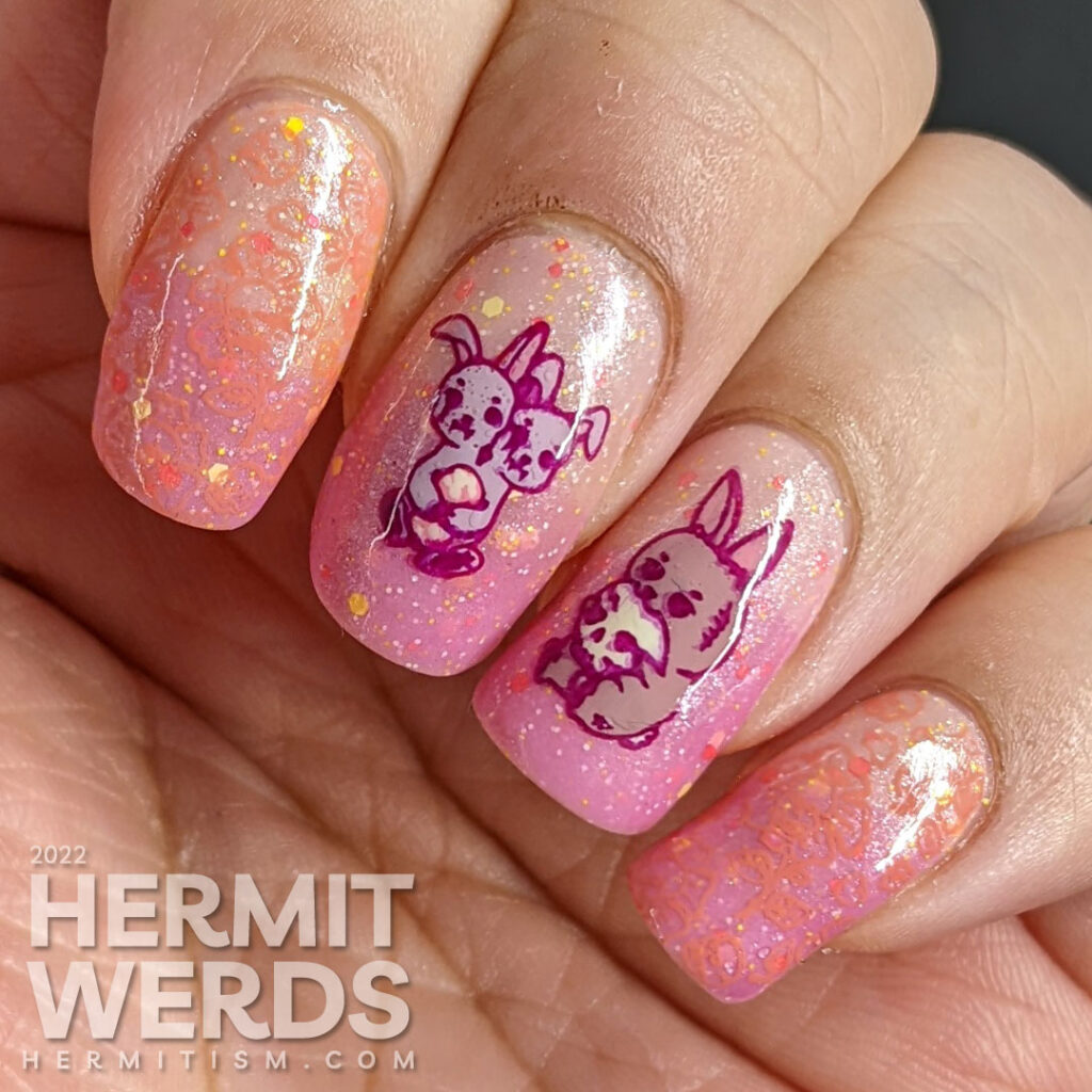 A holiday mashup nail design for Halloween and Easter with a pink/yellow thermal polish and zombie/monster rabbit stamping decals.