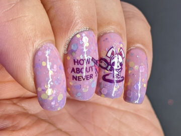 An anti-Valentine/Easter/Halloween pink/purple solar crelly mani with emo bunny stamping decals wielding indifference and a chainsaw/knife.