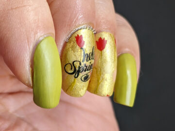 A spring floral mani with yellow, red, and pink tulips and a watering can stamped over a bright green holographic polish.