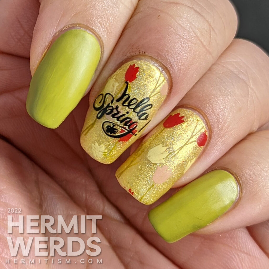 A spring floral mani with yellow, red, and pink tulips and a watering can stamped over a bright green holographic polish.