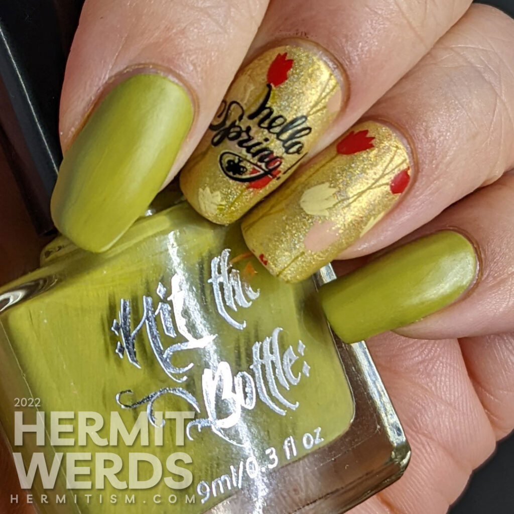 A spring floral mani with yellow, red, and pink tulips and a watering can stamped over a bright green holographic polish.