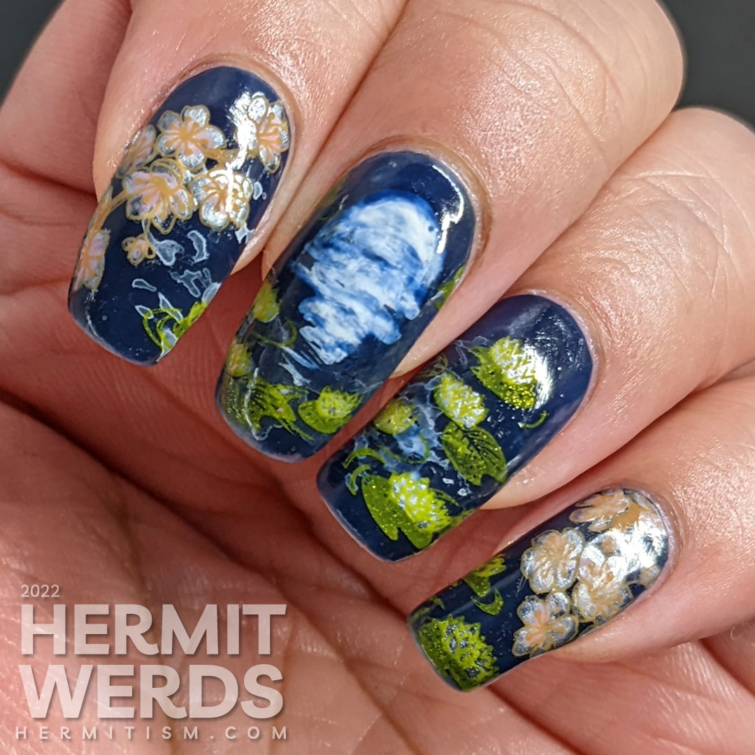 A smoky blue lily pond mani with the reflection of the flower moon shining forth, spring cherry blossom stamping decals, and koi.