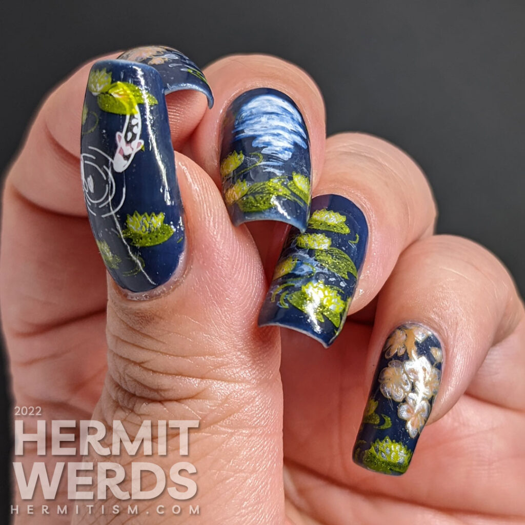 A smoky blue lily pond mani with the reflection of the flower moon shining forth, spring cherry blossom stamping decals, and koi.