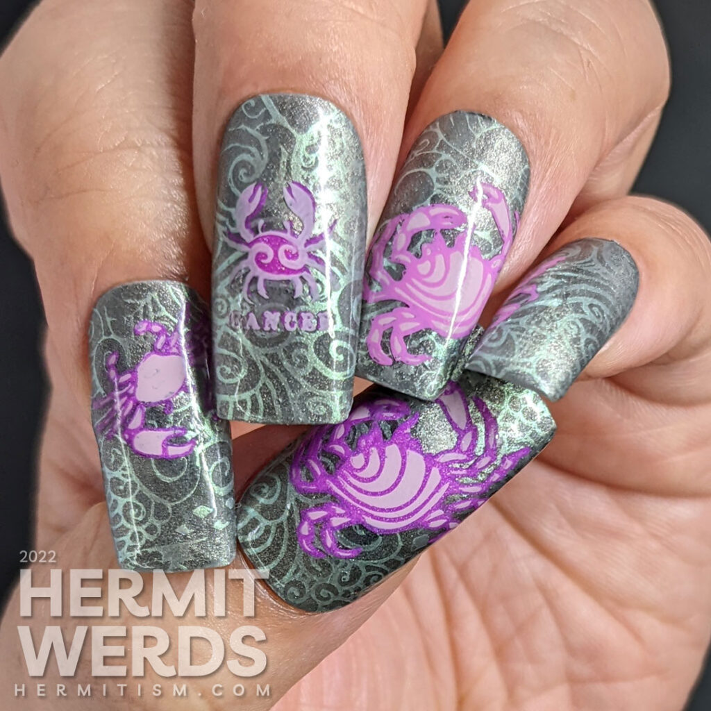 A sterling silver magnetic (zodiac) cancer nail art w/reverse stamping decals of crabs and a swirly ocean/shell background pattern.