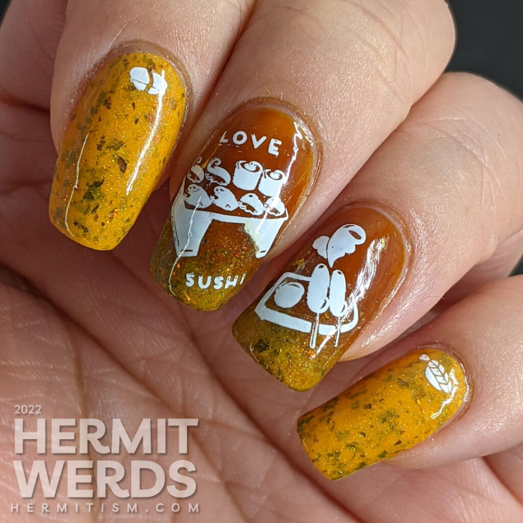 A simple mustard and turmeric sushi nail art with stamping images of a tray of sushi, nigiri, and a few other Japanese treats.