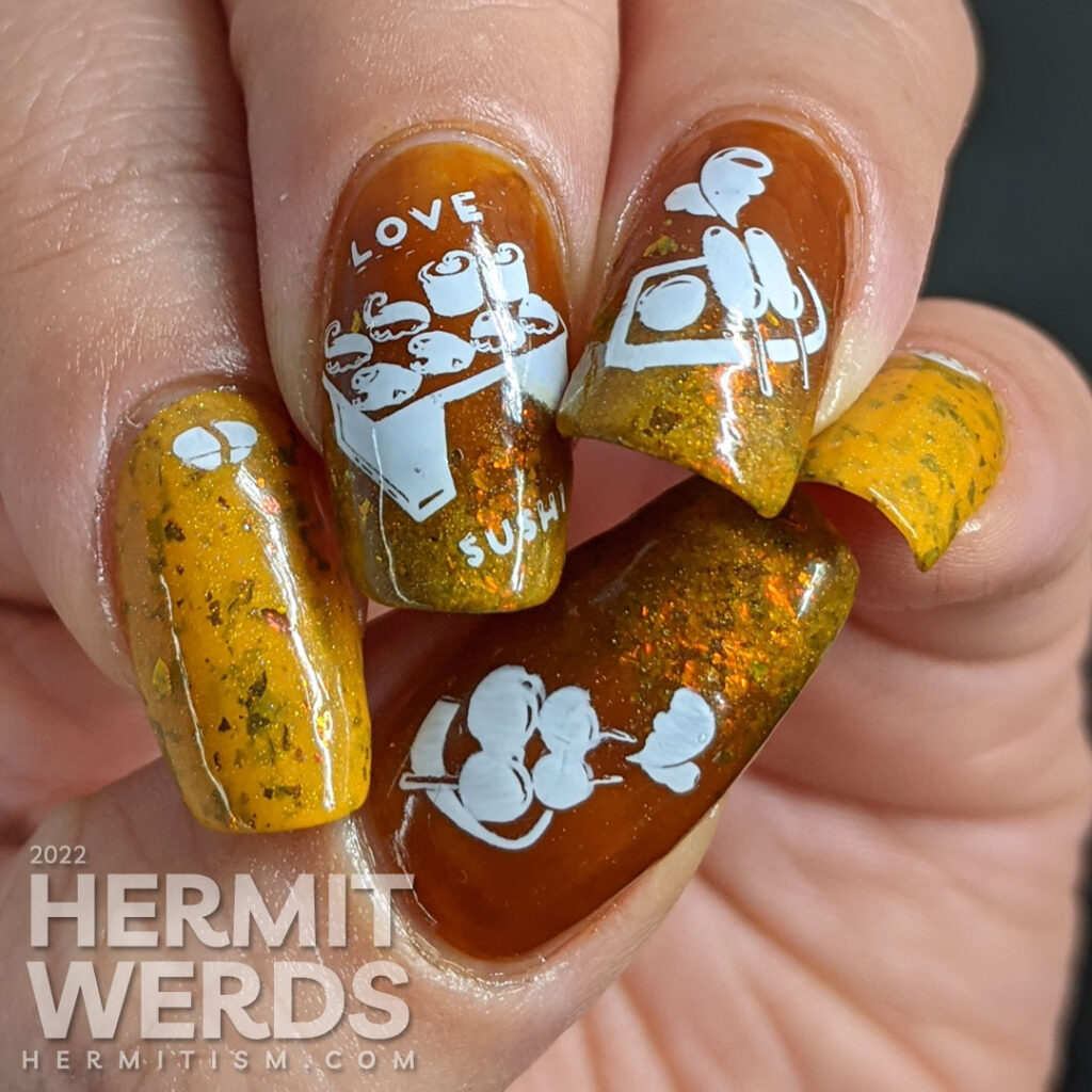 A simple mustard and turmeric sushi nail art with stamping images of a tray of sushi, nigiri, and a few other Japanese treats.