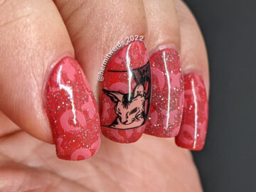 A silly dark coral nail art with lots of "XOXO" nail stamps and an image of a lady licking her kitty cat. Is it love or revenge?