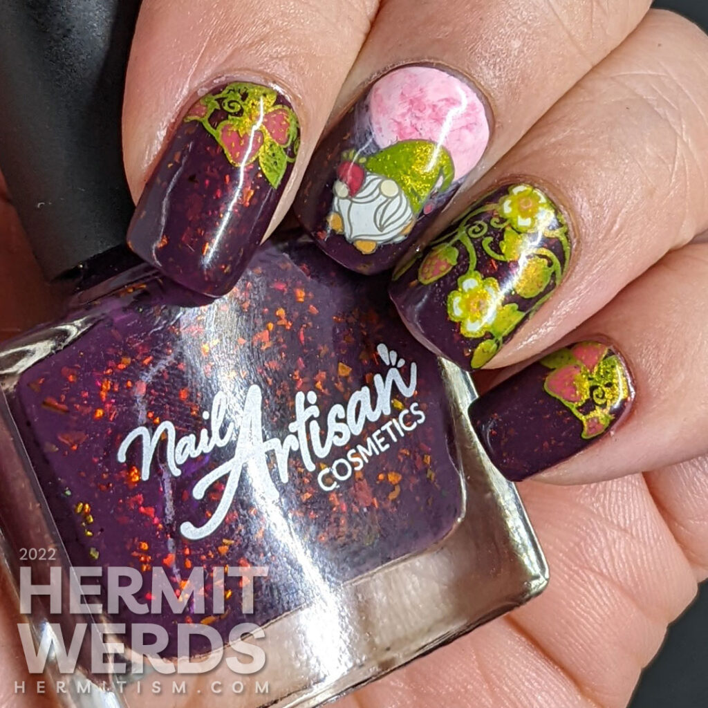 A raisin-colored night sky strawberry moon nail art with a full pink freehanded moon + strawberry gnome and strawberry plant stamping decals.