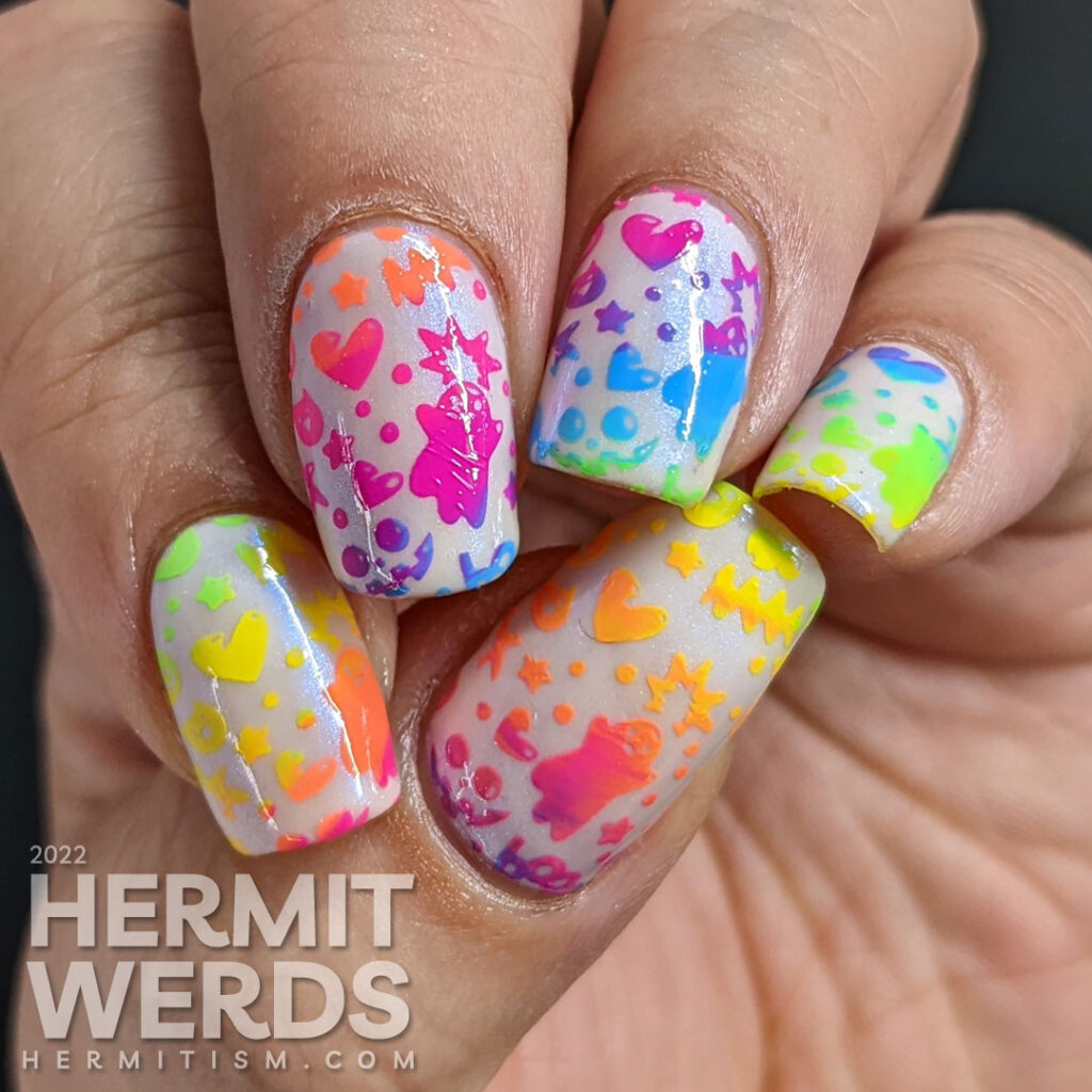 A kawaii Halloween / devil nail art with a neon rainbow gradient full nail background stamp.