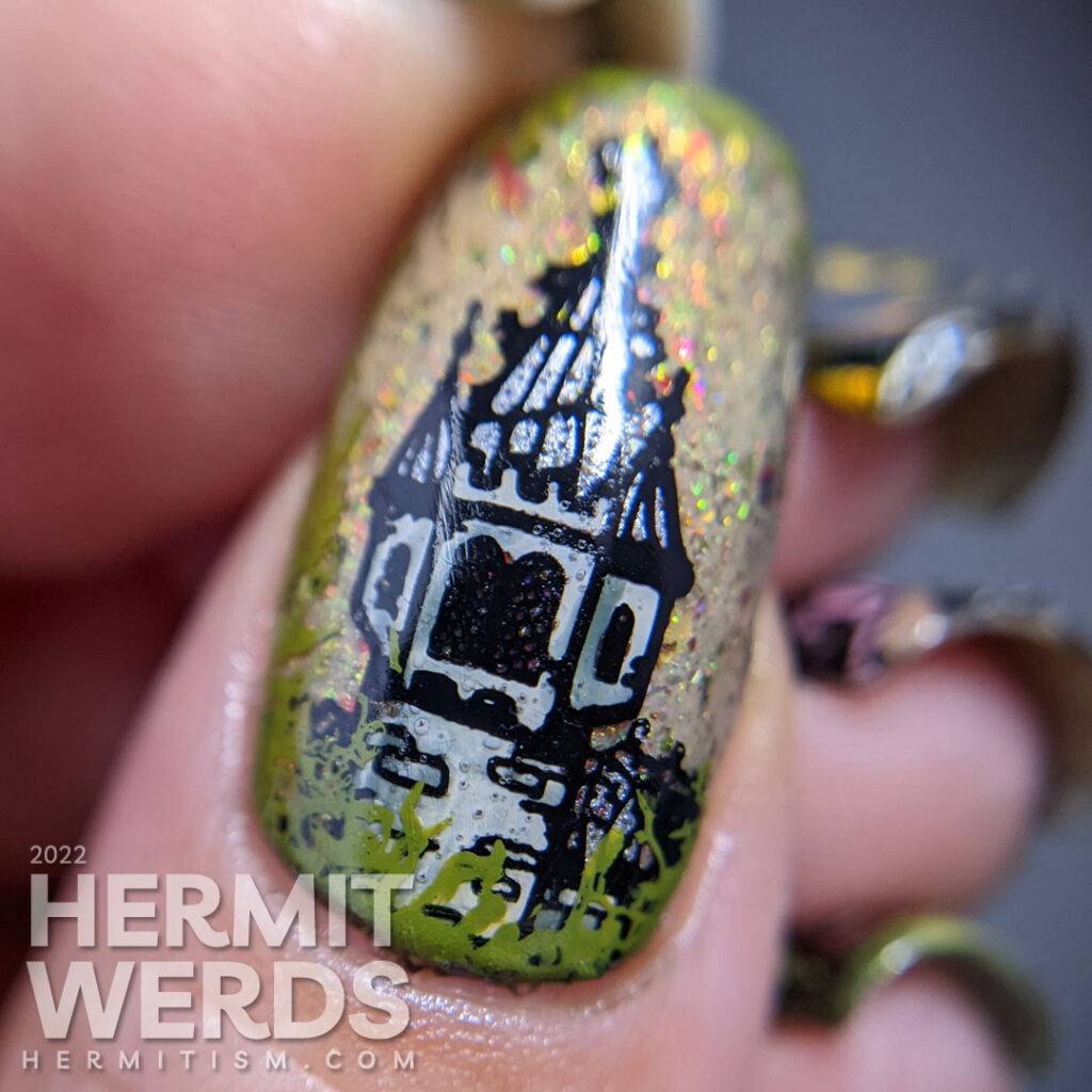 A glitzy Sleeping Beauty nail art with stamping decals of a castle buried in thorns, thorns, lady knight, and the princess (aurora).