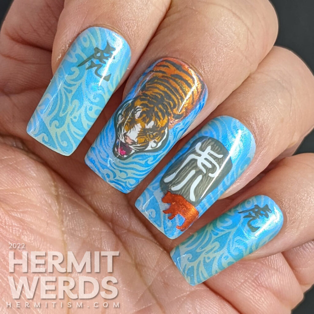 Chinese New Year of the Tiger nail art in their lucky colors (blue, grey, white, orange) w/nail stamping decals of tigers & Chinese characters.