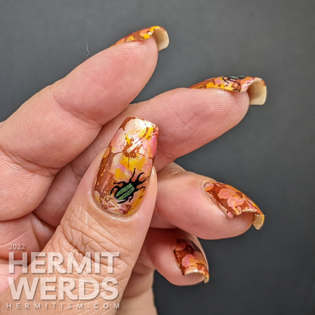 Tropical nail art with a solar polish smoosh marble base, negative space hibiscus flowers, and reverse stamping green beetles on top.