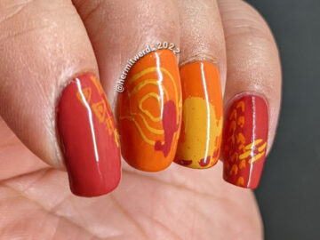 A modern red, orange, and yellow (mustard) cactus nail art combined with abstract shapes to create a fun minimalist look.