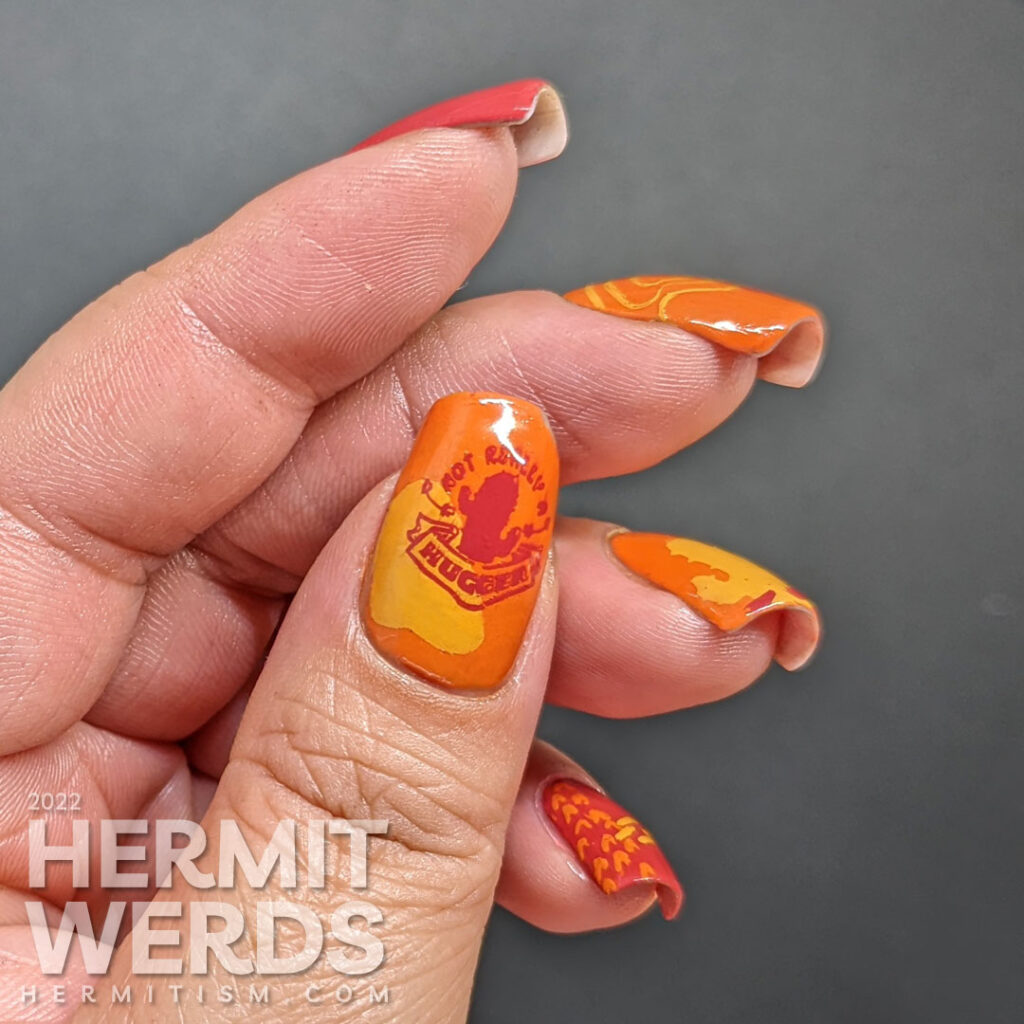 A modern red, orange, and yellow (mustard) cactus nail art combined with abstract shapes to create a fun minimalist look.