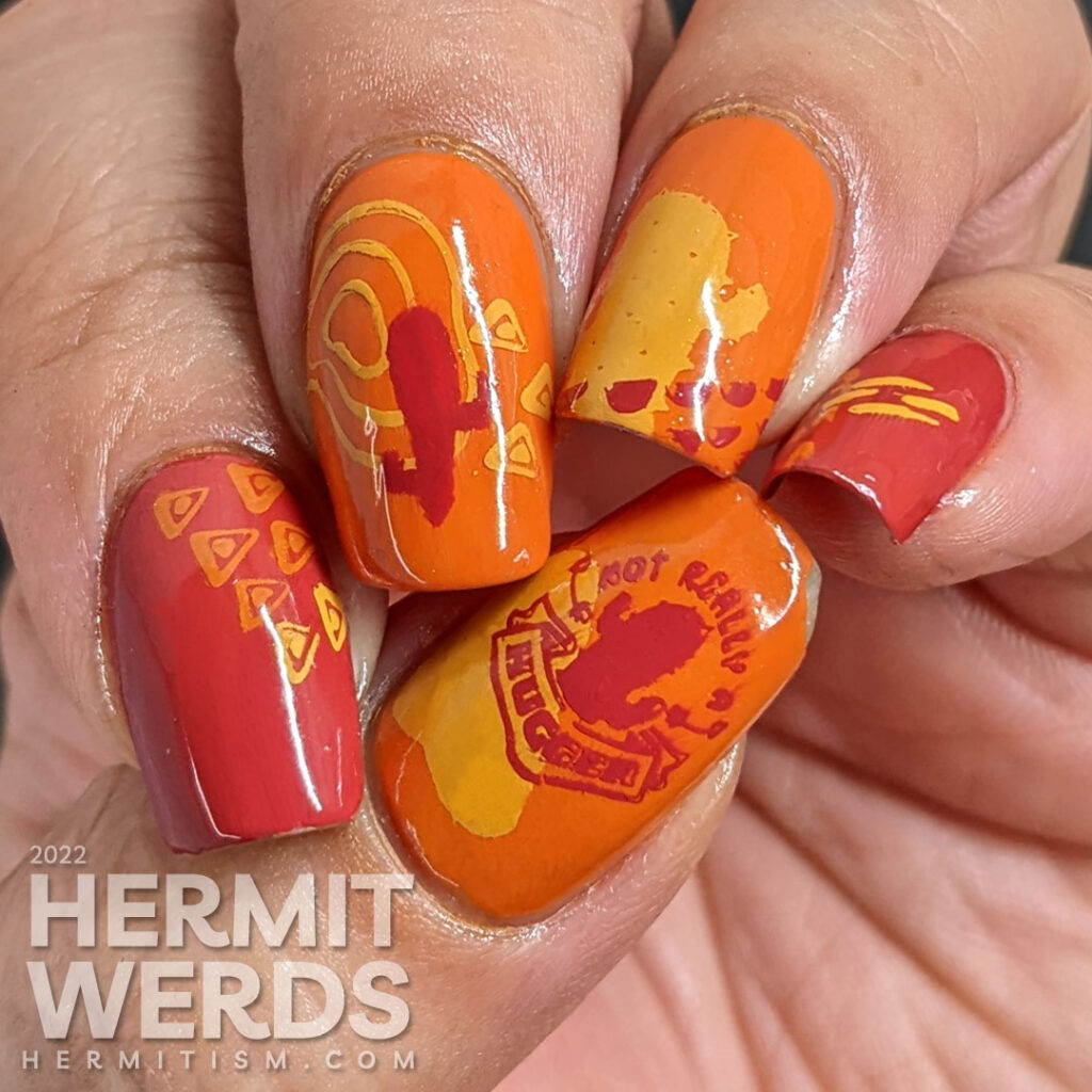 A modern red, orange, and yellow (mustard) cactus nail art combined with abstract shapes to create a fun minimalist look.