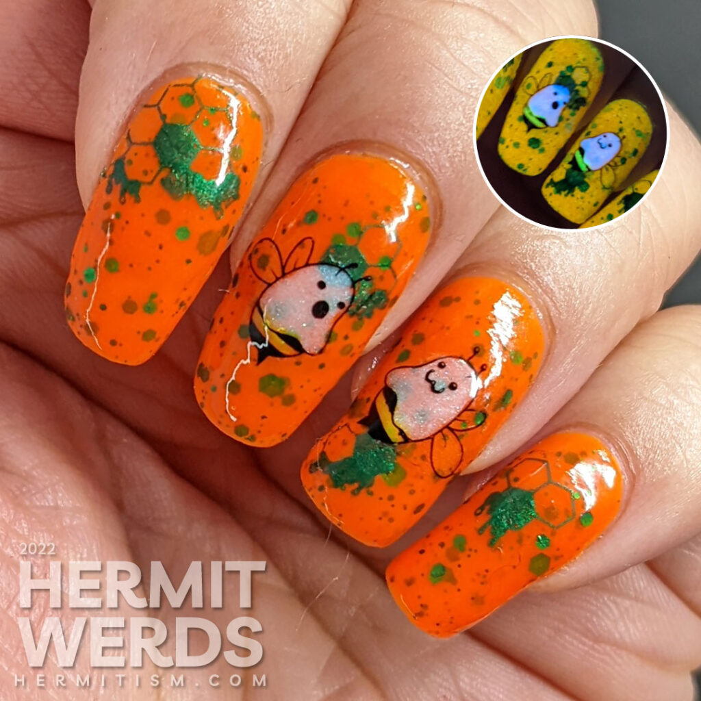 A punny bee nail art with stamping decals of ghost bees (boo bees) on a bright orange crelly with green glitter that glows orange in the dark.