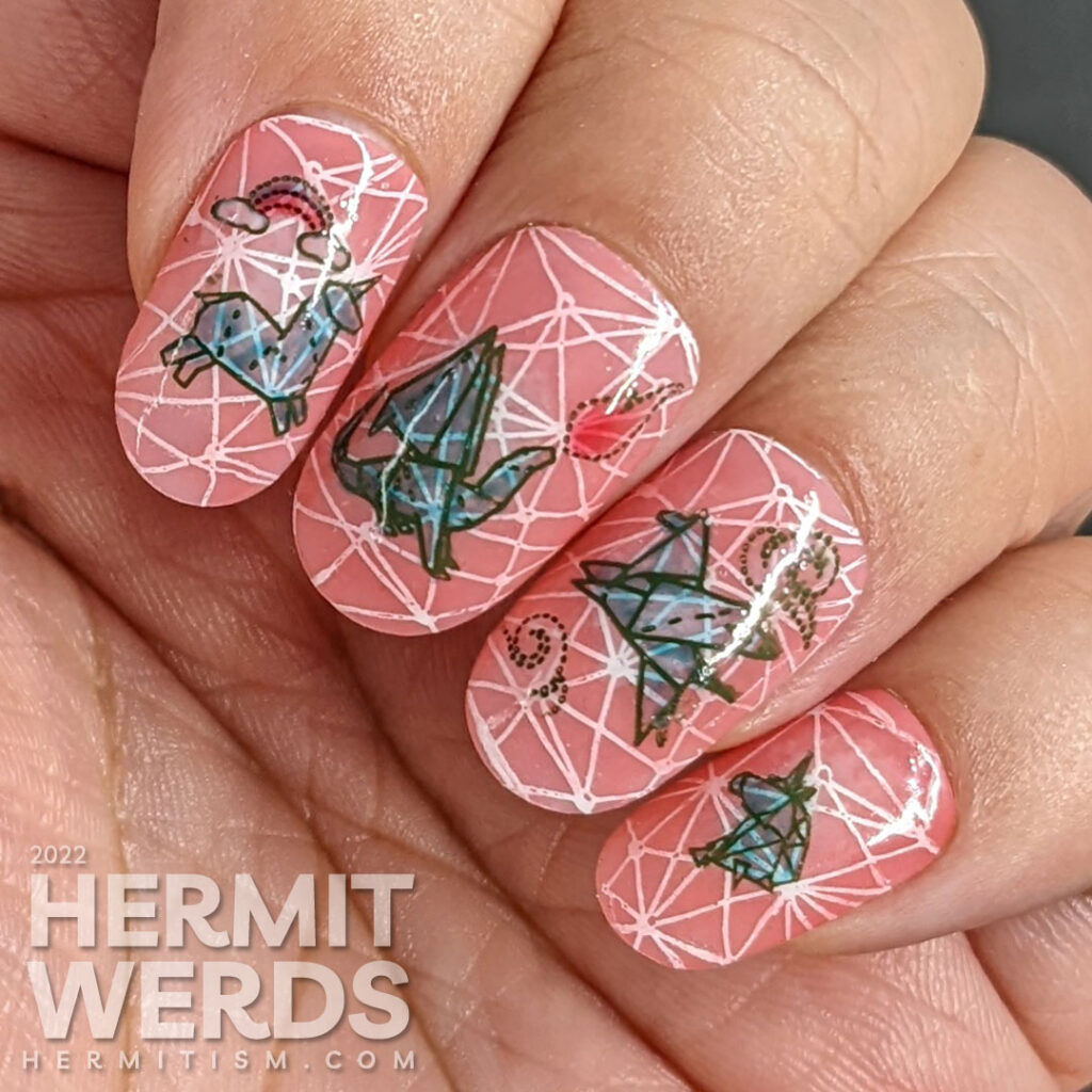 Mythical nail art with teal origami stamping decals of dragons, unicorns, and Pegasus on top of a jelly coral base and pond geometric pattern.