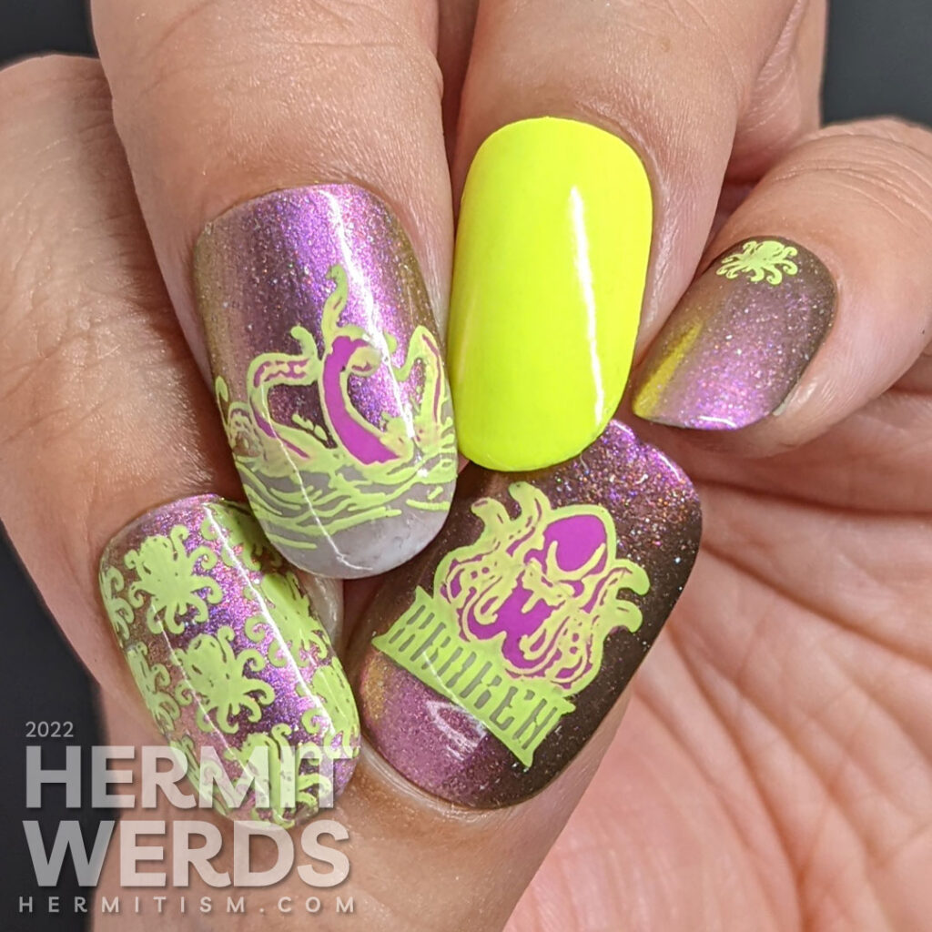 A magnetic monstrous purple-y pink and neon yellow-green kraken nail art with stamping decals of kraken patterns and tentacles in the ocean.A magnetic monstrous purple-y pink and neon yellow-green kraken nail art with stamping decals of kraken patterns and tentacles in the ocean.