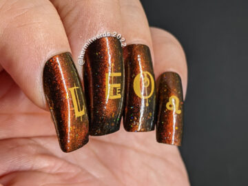 A fiery magnetic nail art for the zodiac sign Leo; stamping decals include a geometric letters spell "Leo", a Leo symbol + a lion-like lady.