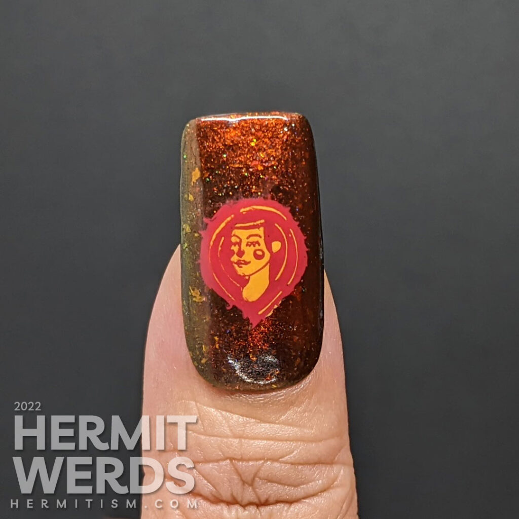 A fiery magnetic nail art for the zodiac sign Leo; stamping decals include a geometric letters spell "Leo", a Leo symbol + a lion-like lady.