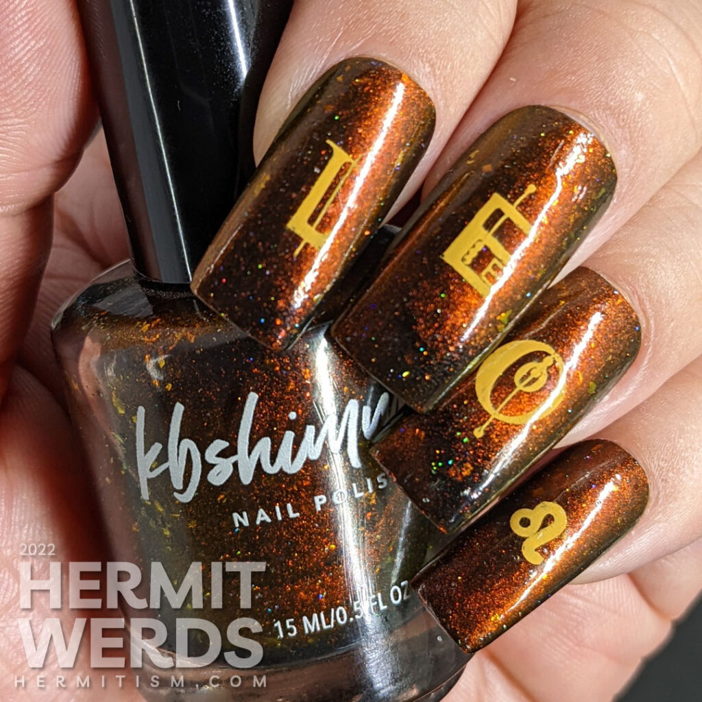 A fiery magnetic nail art for the zodiac sign Leo; stamping decals include a geometric letters spell "Leo", a Leo symbol + a lion-like lady.