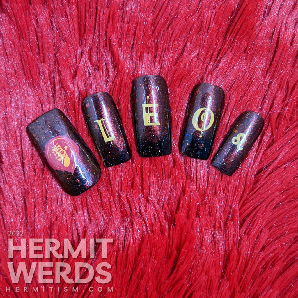 A fiery magnetic nail art for the zodiac sign Leo; stamping decals include a geometric letters spell "Leo", a Leo symbol + a lion-like lady.A fiery magnetic nail art for the zodiac sign Leo; stamping decals include a geometric letters spell "Leo", a Leo symbol + a lion-like lady.