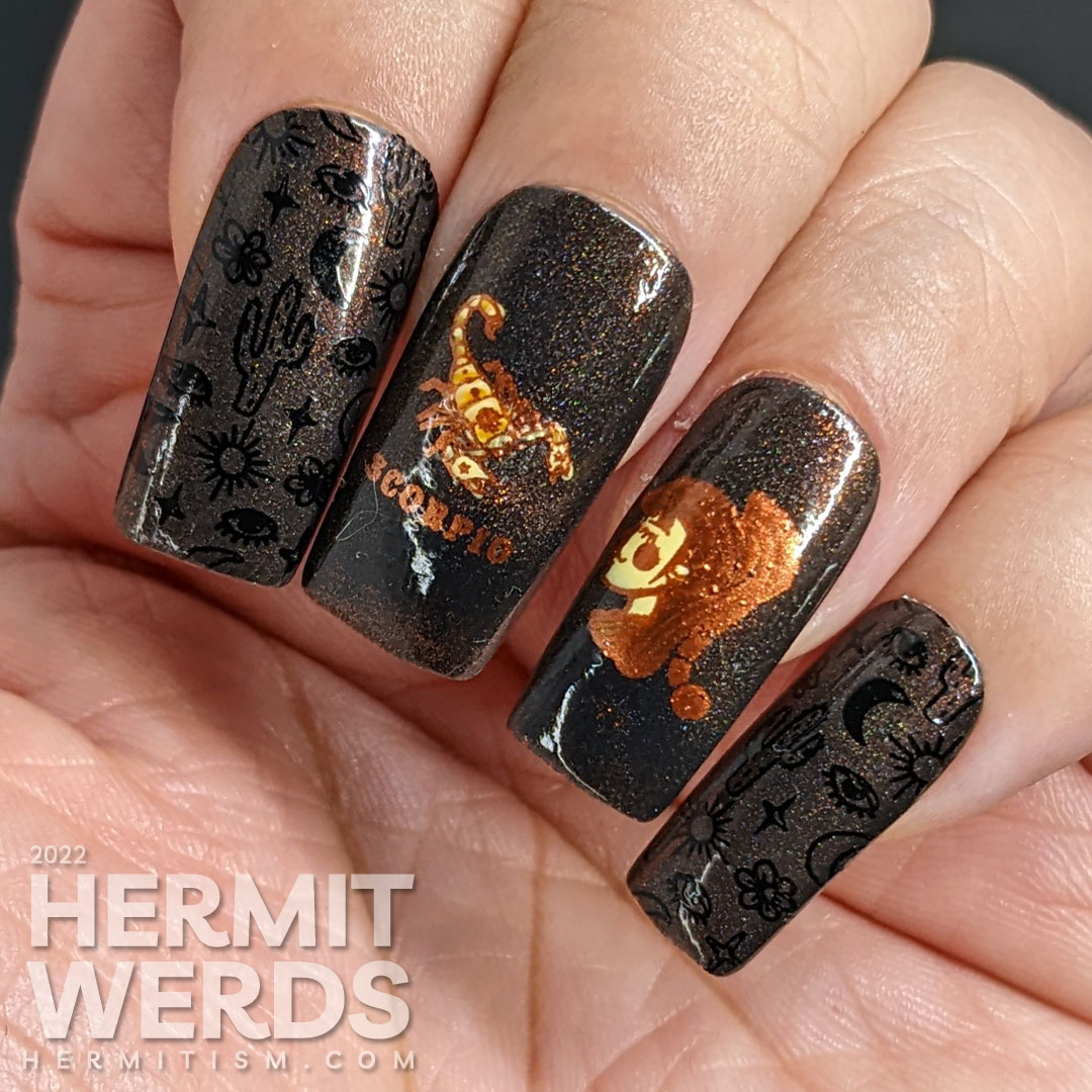 A black magnetic Scorpio nail art with stamping images of desert things, a scorpion lady, and beautiful scorpions in coppers and oranges.