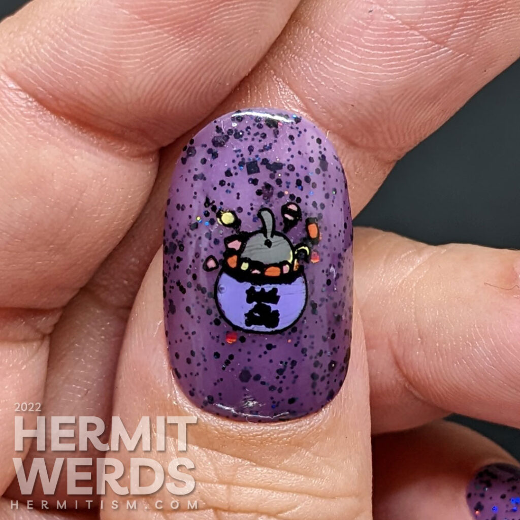 A Halloween cat nail art with sweet black kitties climbing into things on a purple jelly polish filled with black and holographic glitter.