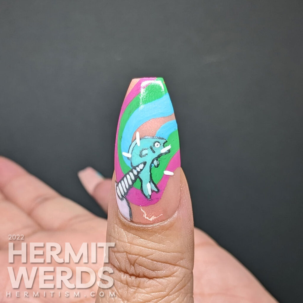 Narwhale nail art with rainbow swirls on a peach background and a freehand painted narwhale painted on top "Tap that fish!".