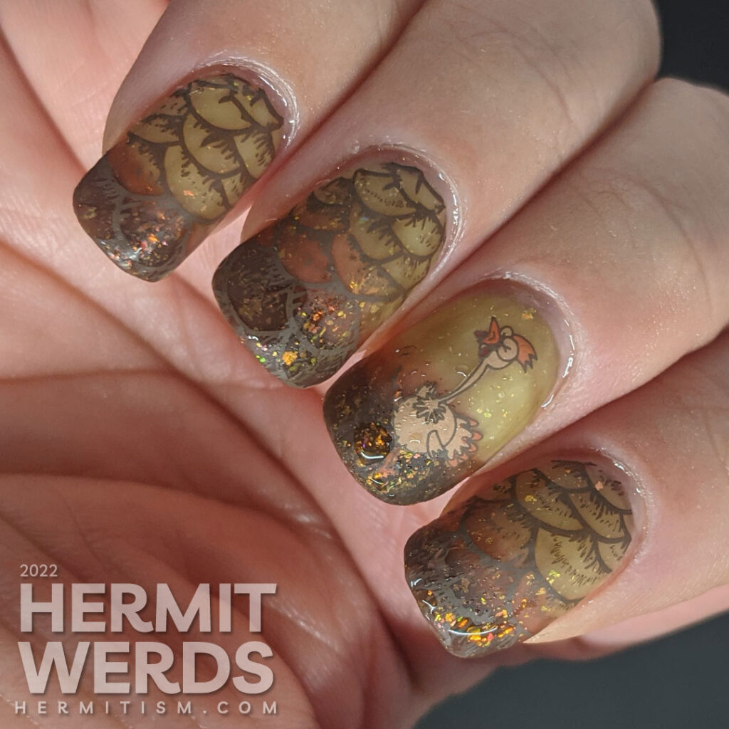 Happy Thanksgiving nails with turkey and turkey feather stamping decals on a yellow/orange/brown tri-thermal gel with a flakie topper on top.