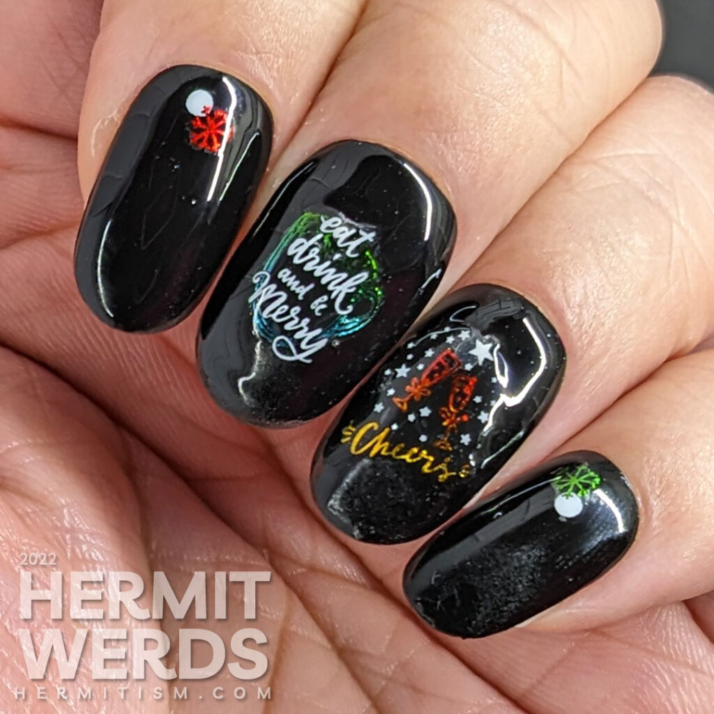 A glossy black holiday season nail art with shiny rainbow nail stickers with white accents offering cheers to a New Year.