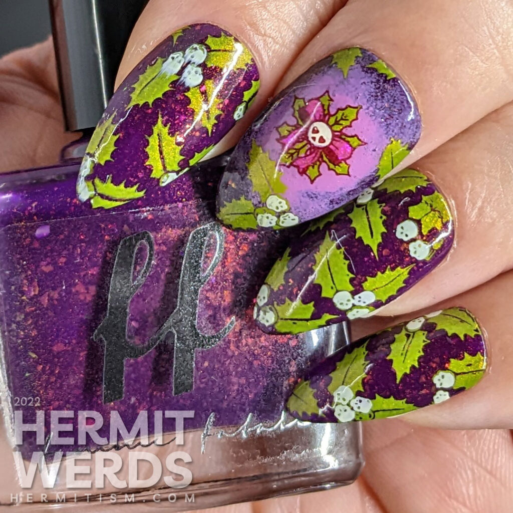 A deadly combination of holly and skulls for Halloween-esque Christmas nail art on a plum indie polish full of iridescent flakes.