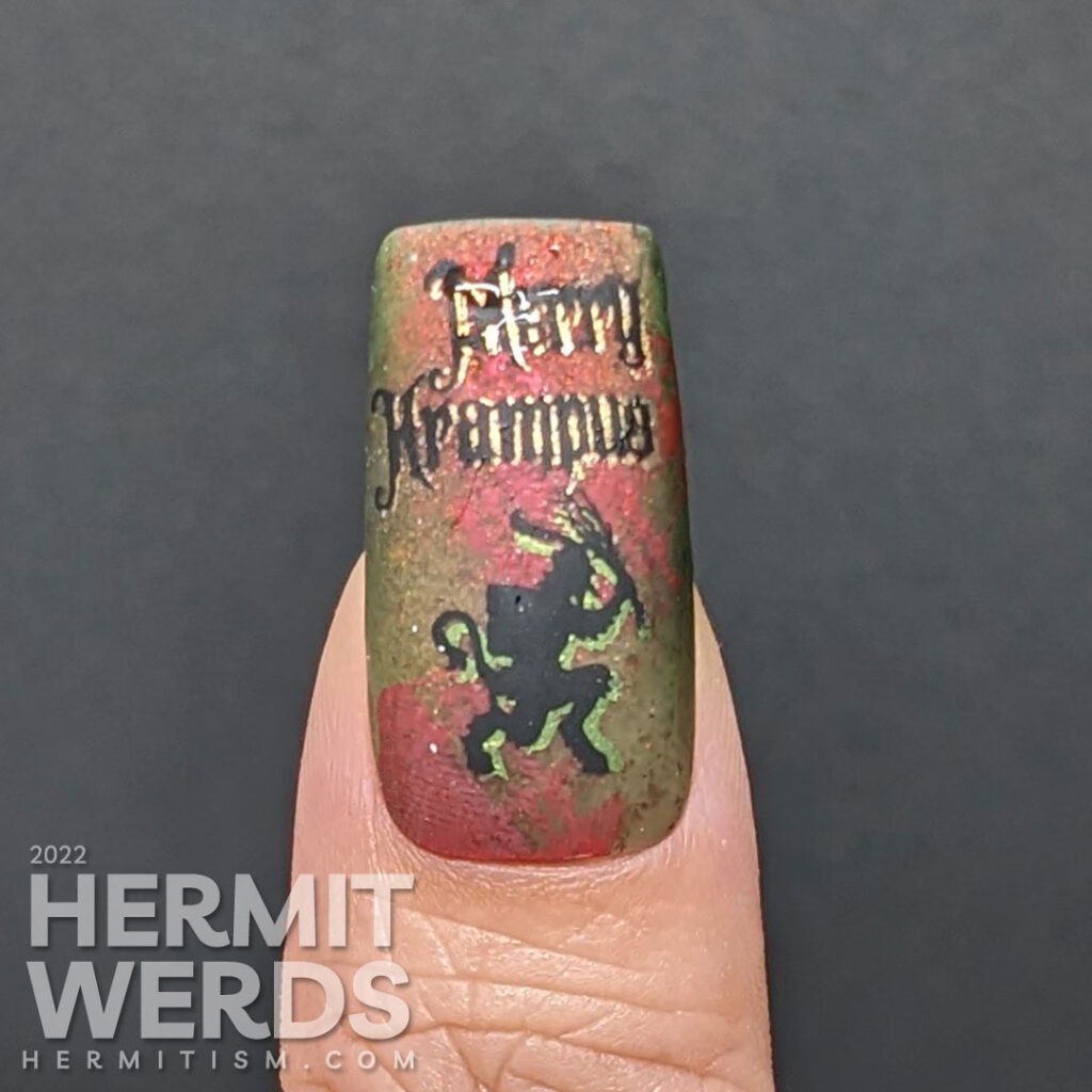 Krampus nail art on a red/green thermal polish with circles of plaid pattern and Halloween-esque things and rejection of jollyness.